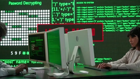 IT specialists against big digital screen. Close shot man and woman programmers Stock Footage 265574264