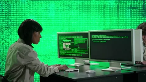 IT specialists against big digital screen. Man and woman programmers work on Stock Footage 265574679