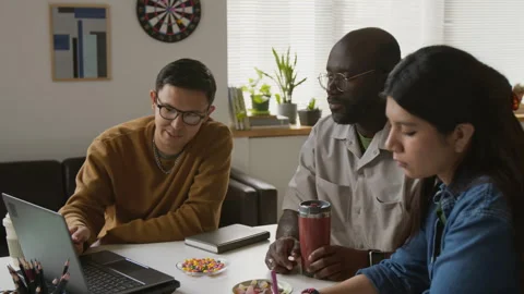 IT Specialists Discussing New App Stock Footage 317344780
