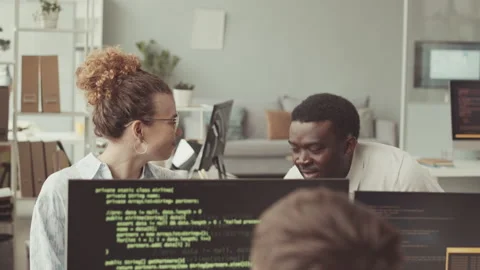 IT Specialists Program Coding on Computers in Office Stock Footage 219309415