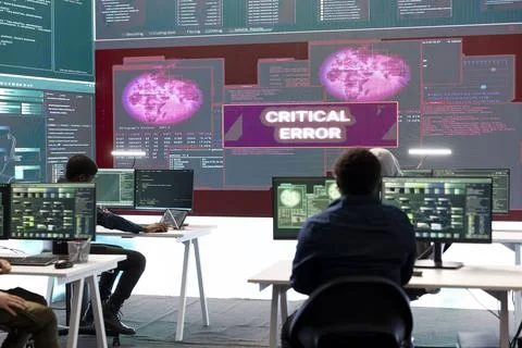 IT specialists receive error messages on big screen after trying to hack system Stock Photos