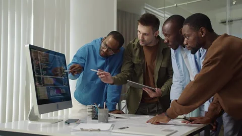 IT Specialists Searching for Bags in Programming Code on Computer Stock Footage 277413789