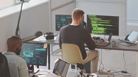 IT Specialists Working on New Software Program in Office Stock Footage 224064293
