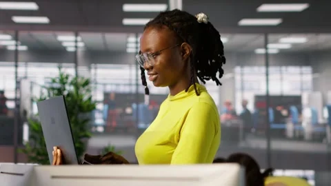 IT staff member using laptop to do programming in office Stock Footage 318159365
