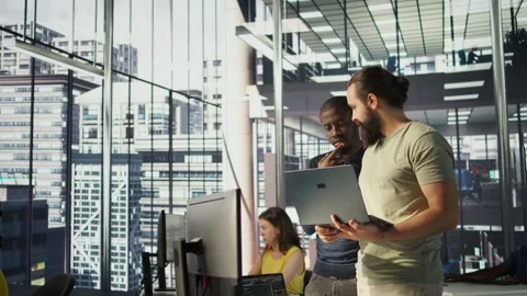IT staff members in office analyzing and interpreting complex data Stock Footage 318232442