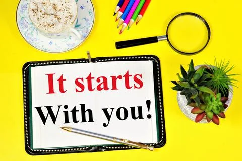 It starts with you. Text caption in notepad for inspiration. Stock Photos
