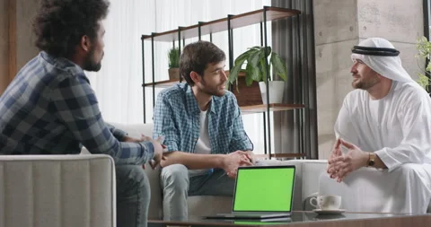 IT startups communicate with Arab investor. IT startup duo confidently presents Stock Footage 252500332