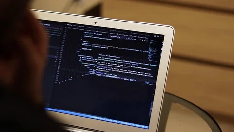 IT student or developer coding on laptop, blurry background with copy space Stock Footage 123013226