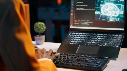 IT student works with artificial intelligence brain system on laptop Stock Photos