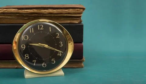 It is study time shown on banner with clock and books Stock Photos