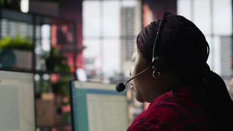 IT support expert in call center troubleshoots errors to minimize downtime Stock Footage 305393735