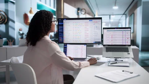 IT Support Specialist Carefully Manages Helpdesk Tickets Using Laptop Stock Footage 341011030