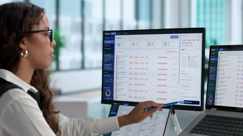 IT Support Specialist Efficiently Tracking Customer Help Desk Tickets Stock Footage 345865174
