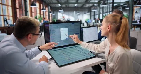 IT Support Team Works Together Solving Customer Issues On Helpdesk System. Stock Photos