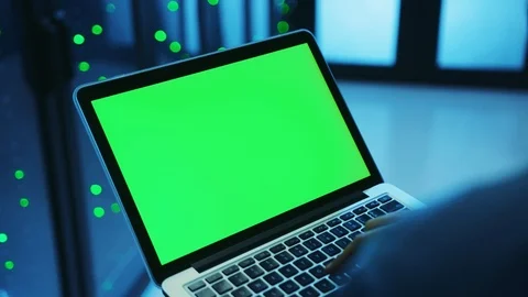 IT system administrator working at database on laptop, clicking a button on Stock Footage 121116991