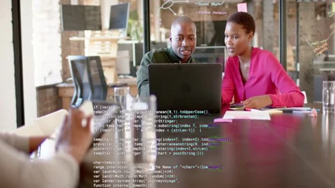 IT team leaning over laptop reviewing while hand swiping tablet scrolling code Stock Footage 333552524