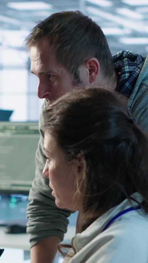 IT team members programming scripts on computer, employing AI machine learning Stock Footage 319575048