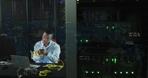 IT tech lifting yellow Ethernet cables, running laptop checks while overlay Stock Footage 332296794