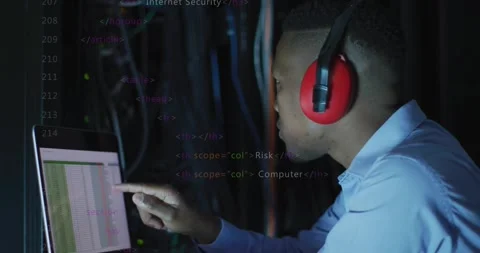 IT tech reacting to log alert tapping laptop tuning rack cables while overlay Stock Footage 333154058