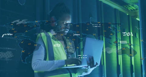 IT tech typing commands at servers causing world map hologram with network nodes Stock Footage 312229306