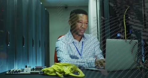 IT tech typing in server room, causing animated status across laptop and panel Stock Footage 331736380