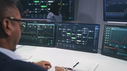 IT technical specialist and team of software programmer work in monitoring Stock Footage 244410656