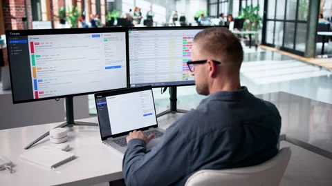 IT Technician Carefully Monitors Computer System Security Stock Footage 332495815
