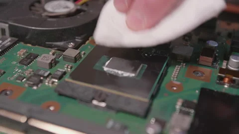 IT technician clean a processor of a notebook Stock Footage 137944964