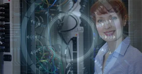 IT technician inspecting network switch cables in data center, with server rack, Stock Photos