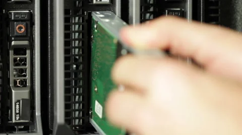 IT technician install hard drive in blade server Stockbeeldmateriaal 53063917