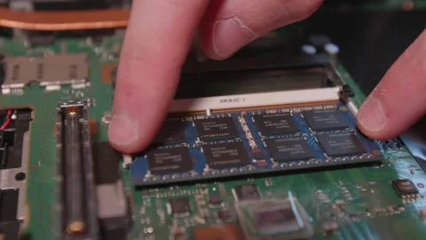 IT technician overhauls one RAM module of a notebook Stock Footage 137944239
