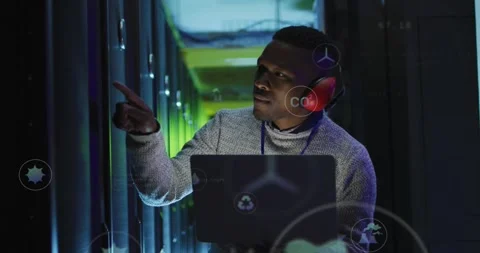 IT technician pointing at racks in data center summoning floating CO2 water Stock Footage 330602913