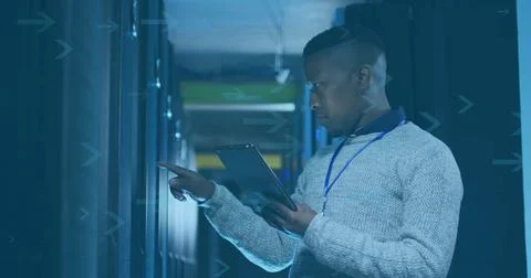 IT technician pointing tablet at blinking server module in data center aisle, Stock Photos