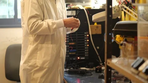 IT technician stripping wires and building network equipment Stock Footage 328480780