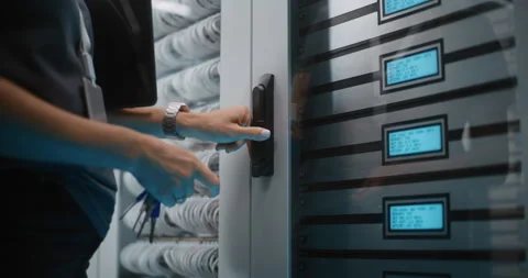 IT Technician Unlocking Server Cabinet Door with Keys Stock Footage 344884300