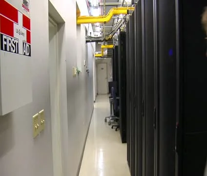 IT technician walks in computer server room Stock Footage 21585266