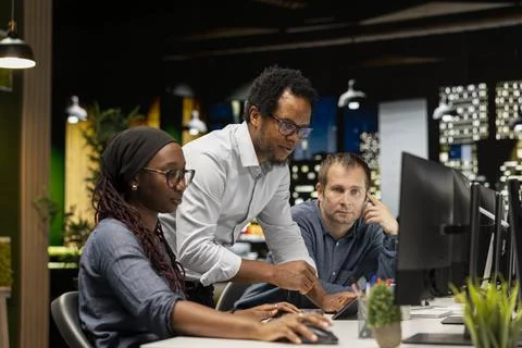 IT technicians cooperating in AI focused startup, debugging applications Stockfoto's