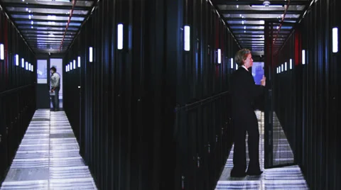 IT Technicians in data center. People working in computer server room data Vídeo Stock 32722708