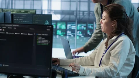 IT technicians in server farm brainstorming ways to repair equipment Stock Footage 319247725