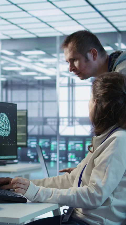 IT technicians in server farm brainstorming ways to repair equipment Stock Footage 319544682