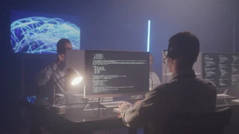 IT Technicians Working Together in a Dark Office Stock Footage 208766652