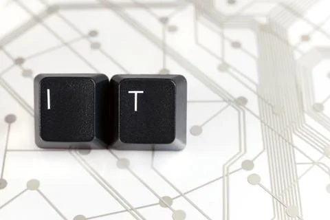 IT, Two Keyboard keys with letters I and T on Circuit Board Stock Photos