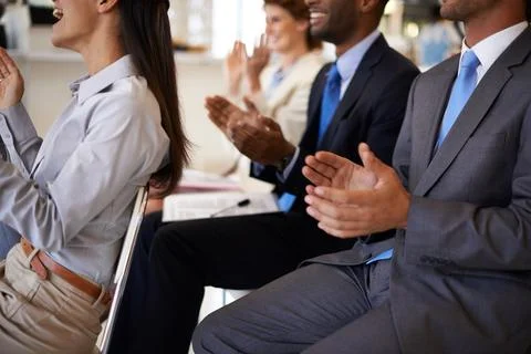 It was an outstanding presentation. a group of businesspeople applauding a work Foto stock