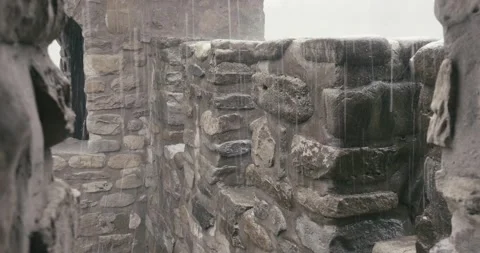 It was raining on the massive stone walls of an ancient fortress Stock Footage 166316458