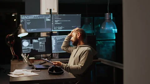 IT web developer comparing data files on clipboard papers Stock Footage 229333099