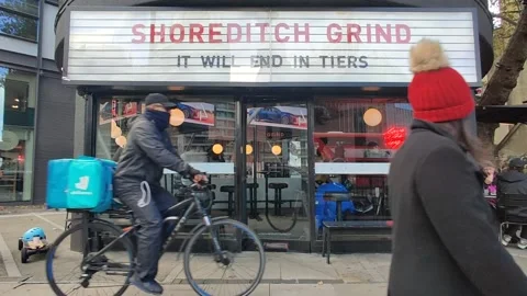 'IT WILL END IN TIERS' SAYS CAFE AS BRITISH ENTER SECOND WAVE OF COVID 4K Stock Footage 143122641