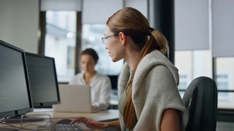 It woman programming code in office. Casual software developer typing computer Stock Footage 242982217