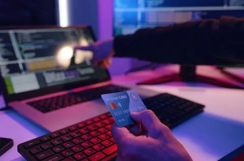 IT Worker Checking Data Of Credit Card On Computer Stock Photos