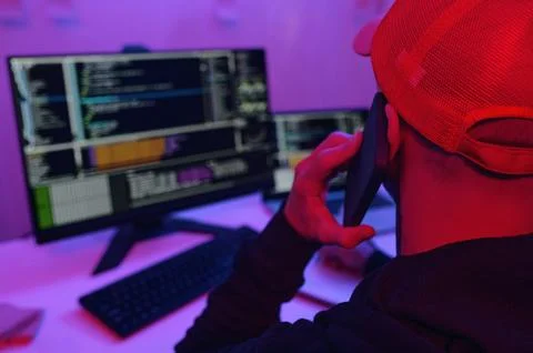 IT Worker Having Conversation On Mobile Phone 写真素材