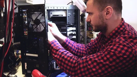 IT worker repairing a PC Stock Footage 104553099